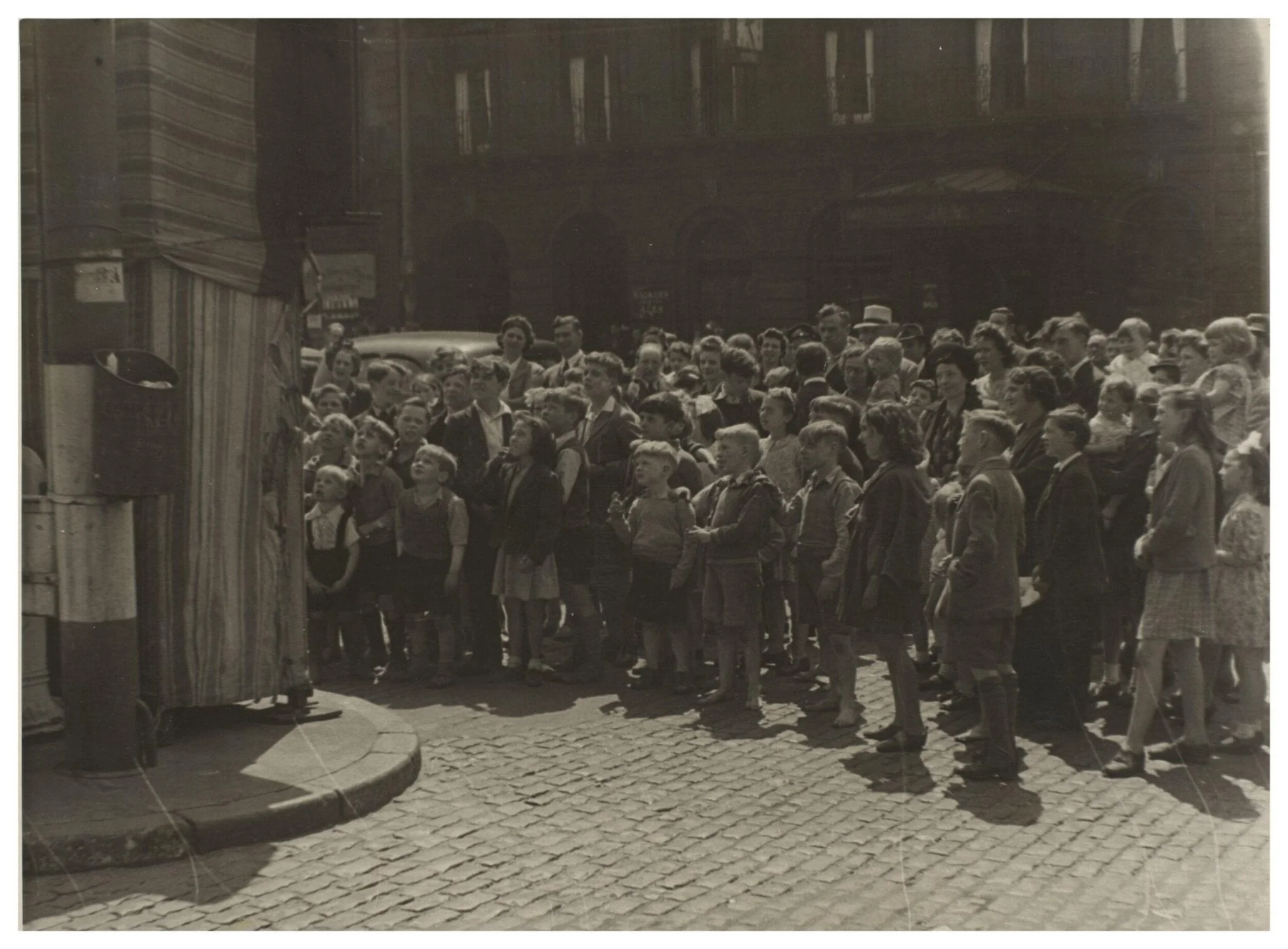 The audience at Professor Richard Codman lll's Punch and Judy booth, Liverpool, ca.1940, detail