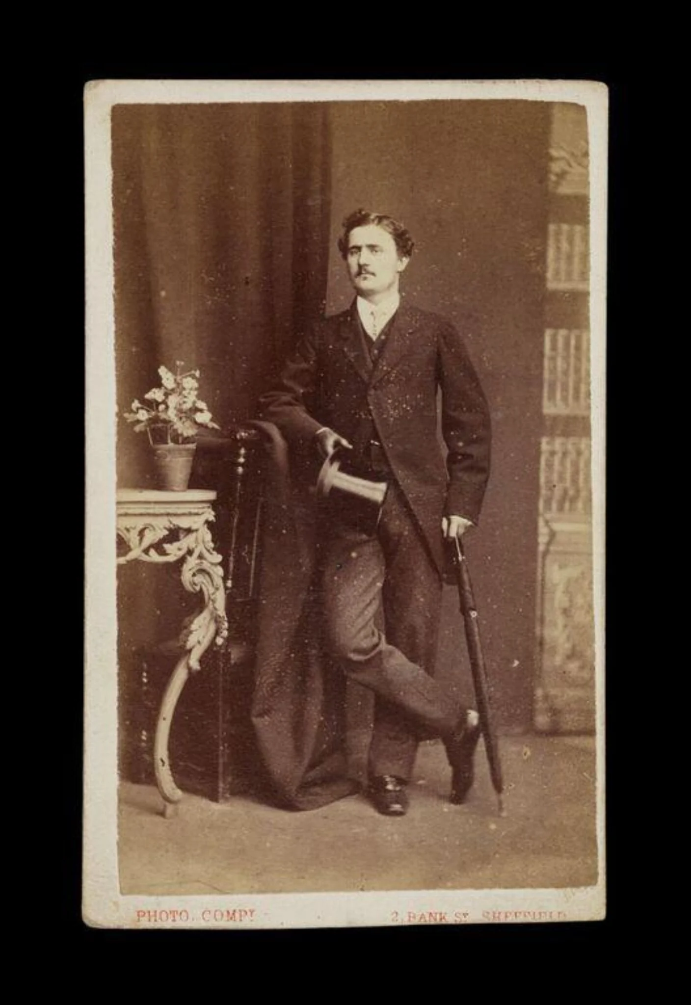 portrait of a man holding an umbrella and top hat, detail