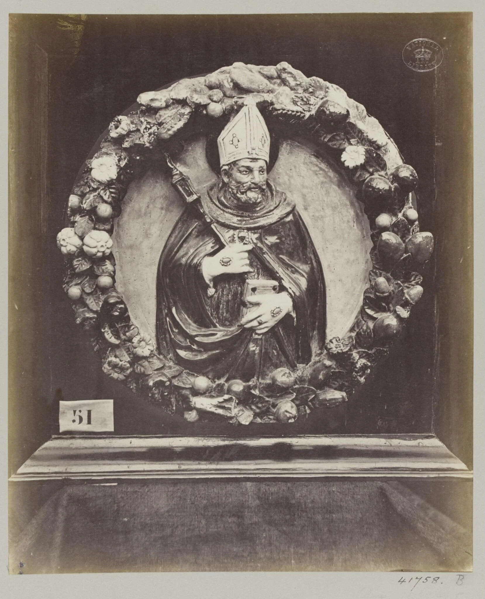 Enamelled earthenware bas-relief medallion of Saint Augustin, detail