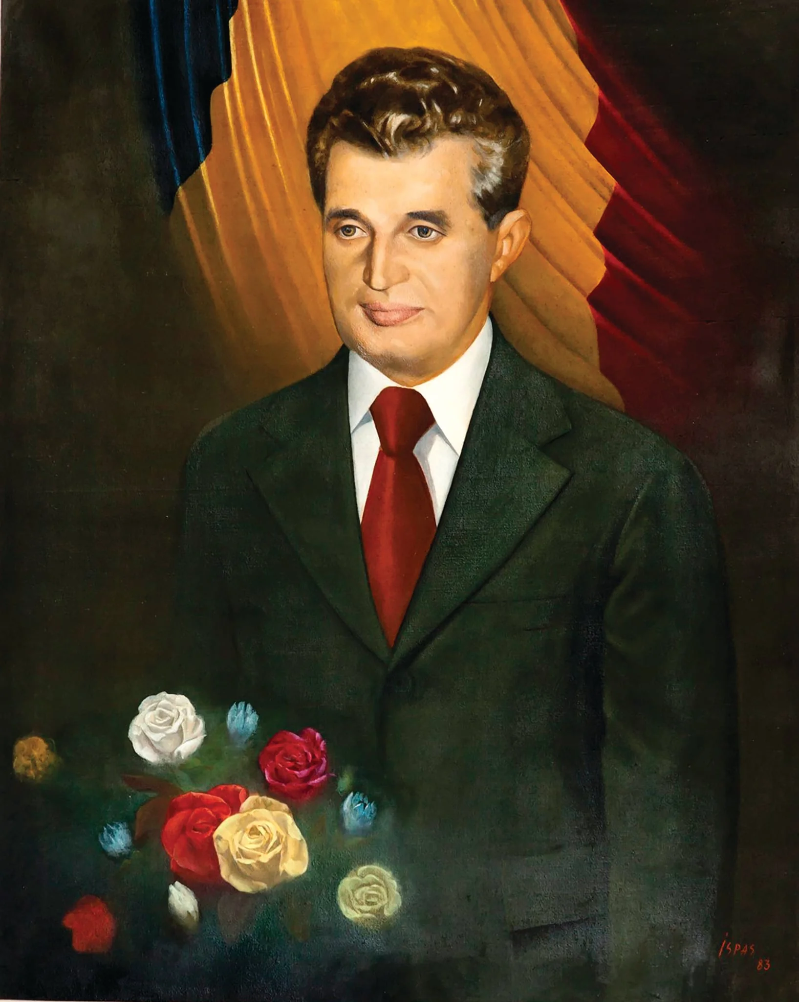Tablou ulei pe pânză, portret Nicolae Ceaușescu semnat Ispas și datat în partea dreaptă jos. Este prezentat într-o postură solemnă cu un buchet de trandafiri, în spatele său tricolorul. Culorile drapelului se regăsesc și în coloritul trandafirilor. Comandat de Comitetul Județean de Partid Alba (1983)., detail