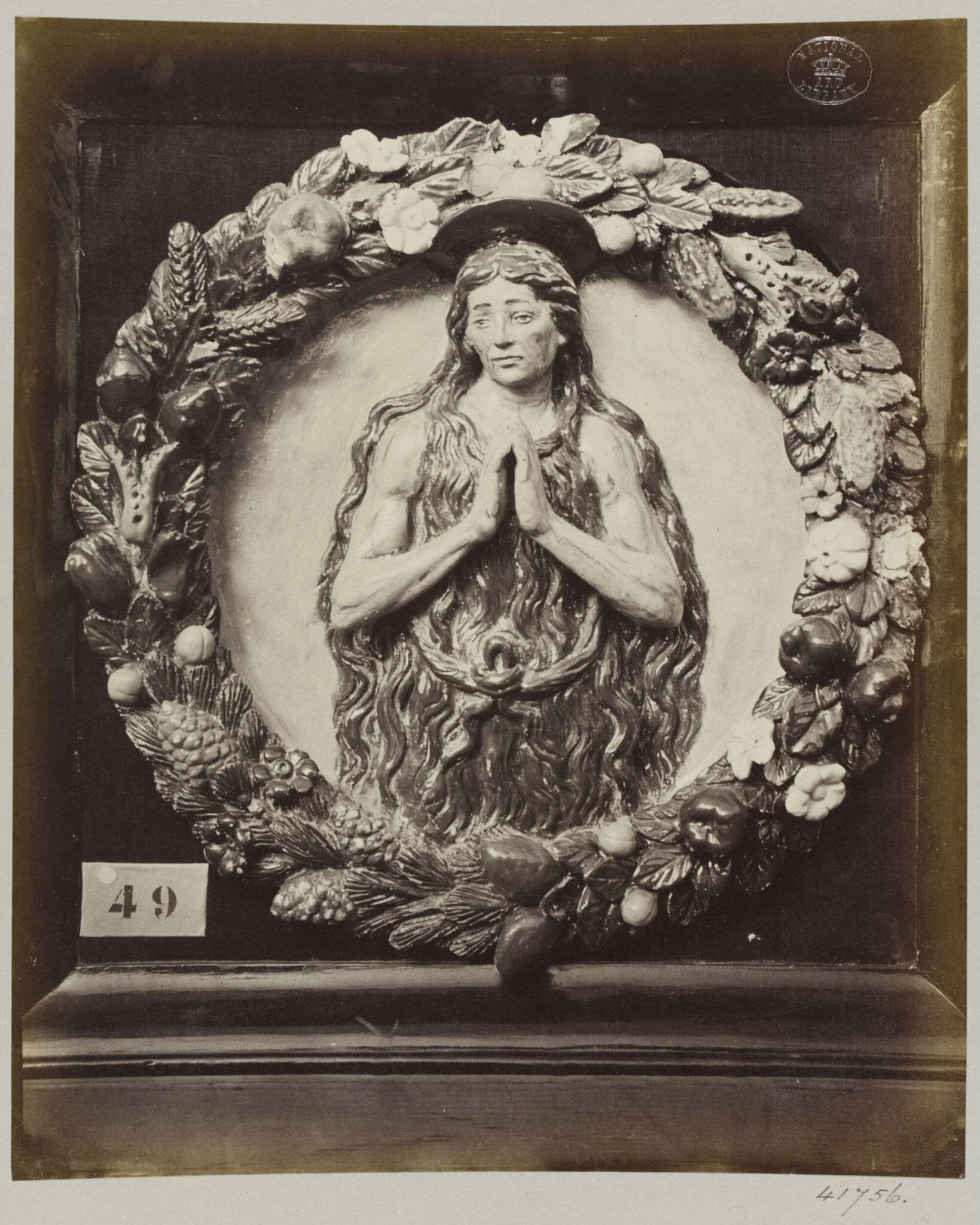 Enamelled earthenware bas-relief medallion of Saint Onofrio, detail