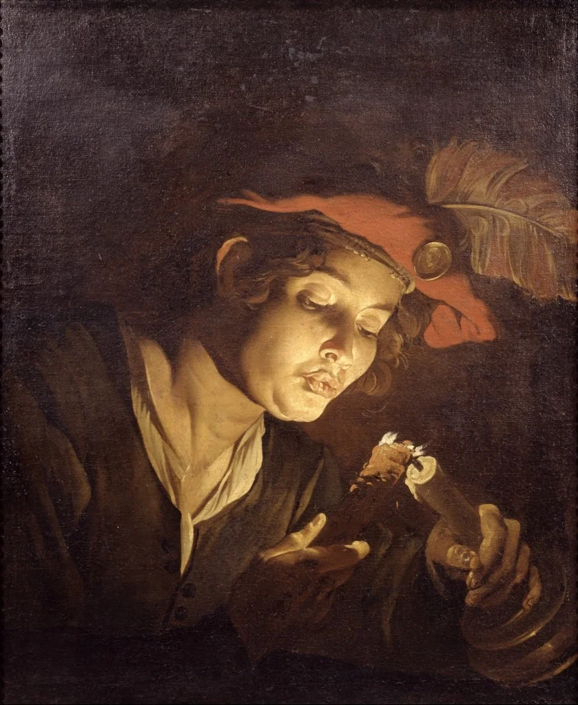 Boy lighting a candle from a wick, detail