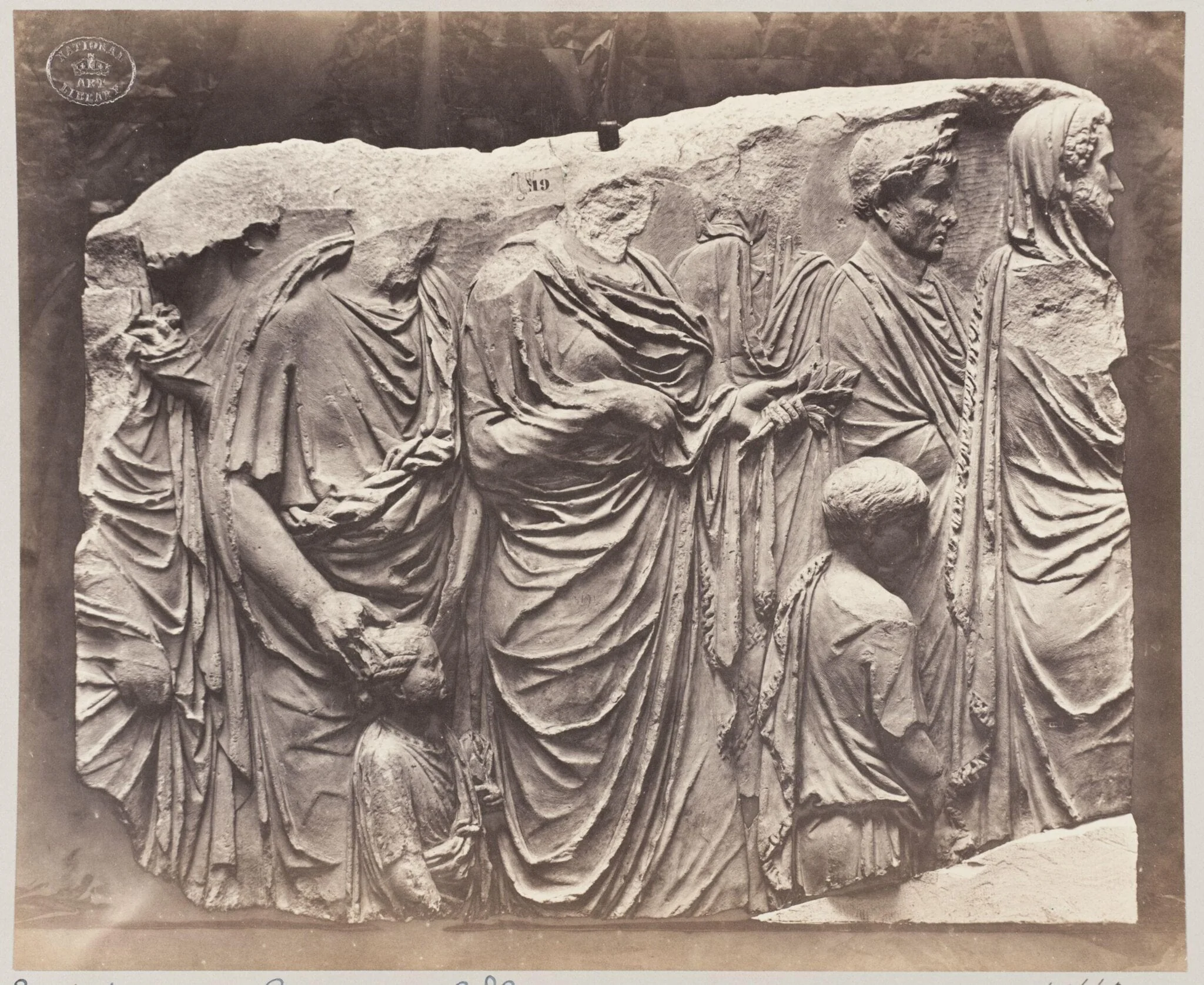 Portion of a marble sarcophagus of procession of draped figures, detail