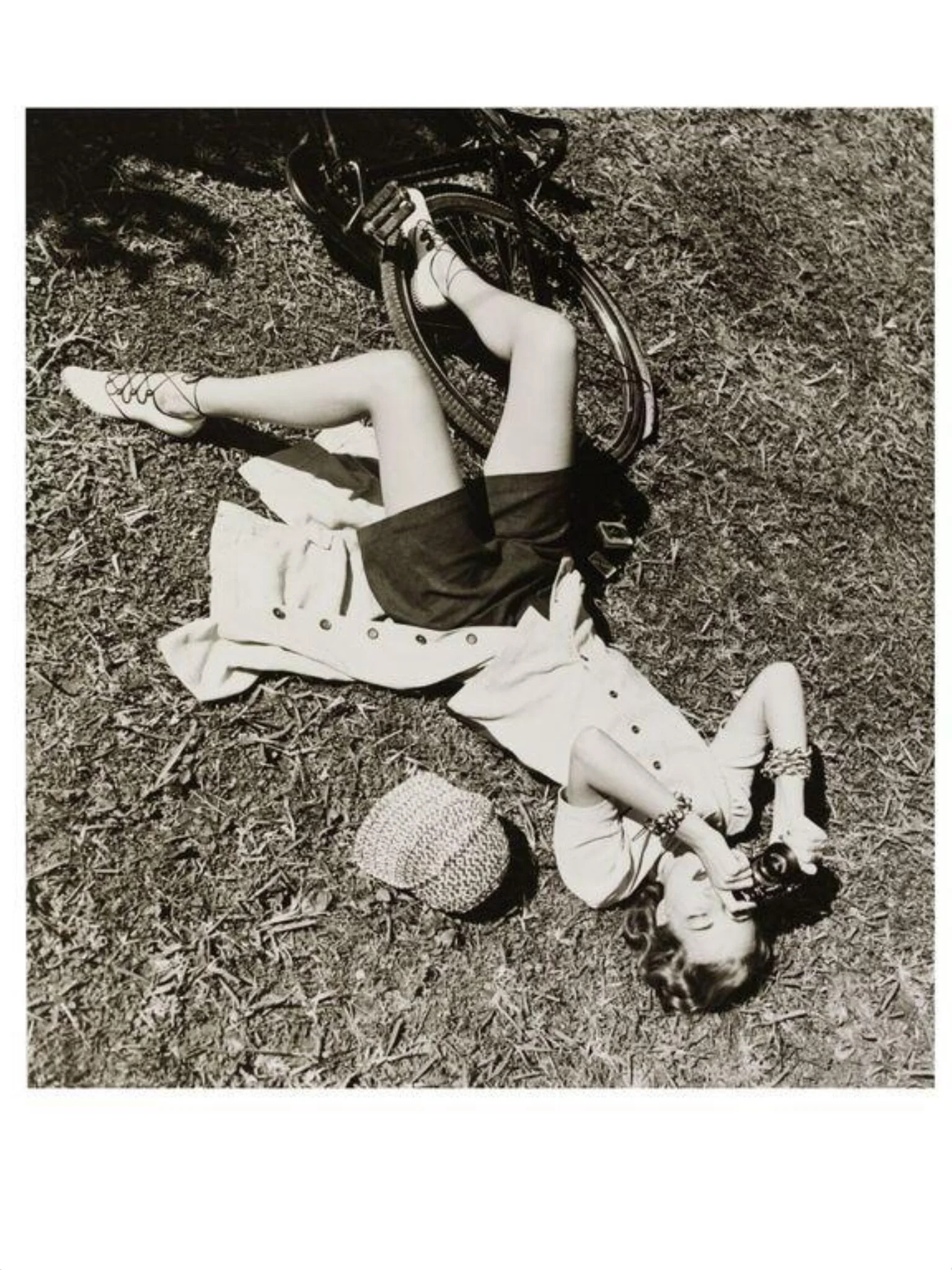 Girl with Camera Lying on Grass, detail
