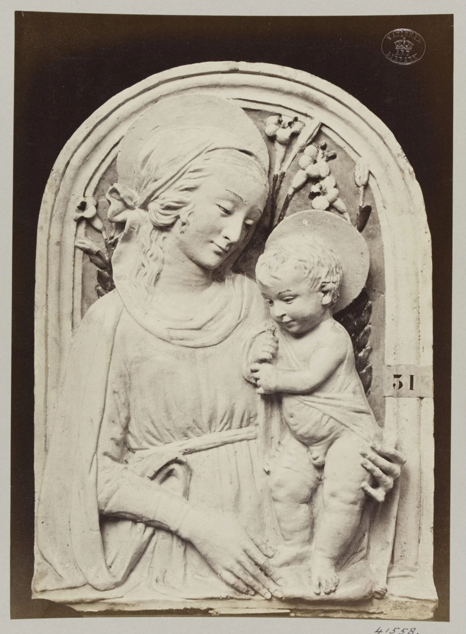 Bas-relief Virgin and Child in enamelled earthenware by Luca della Robbia, detail