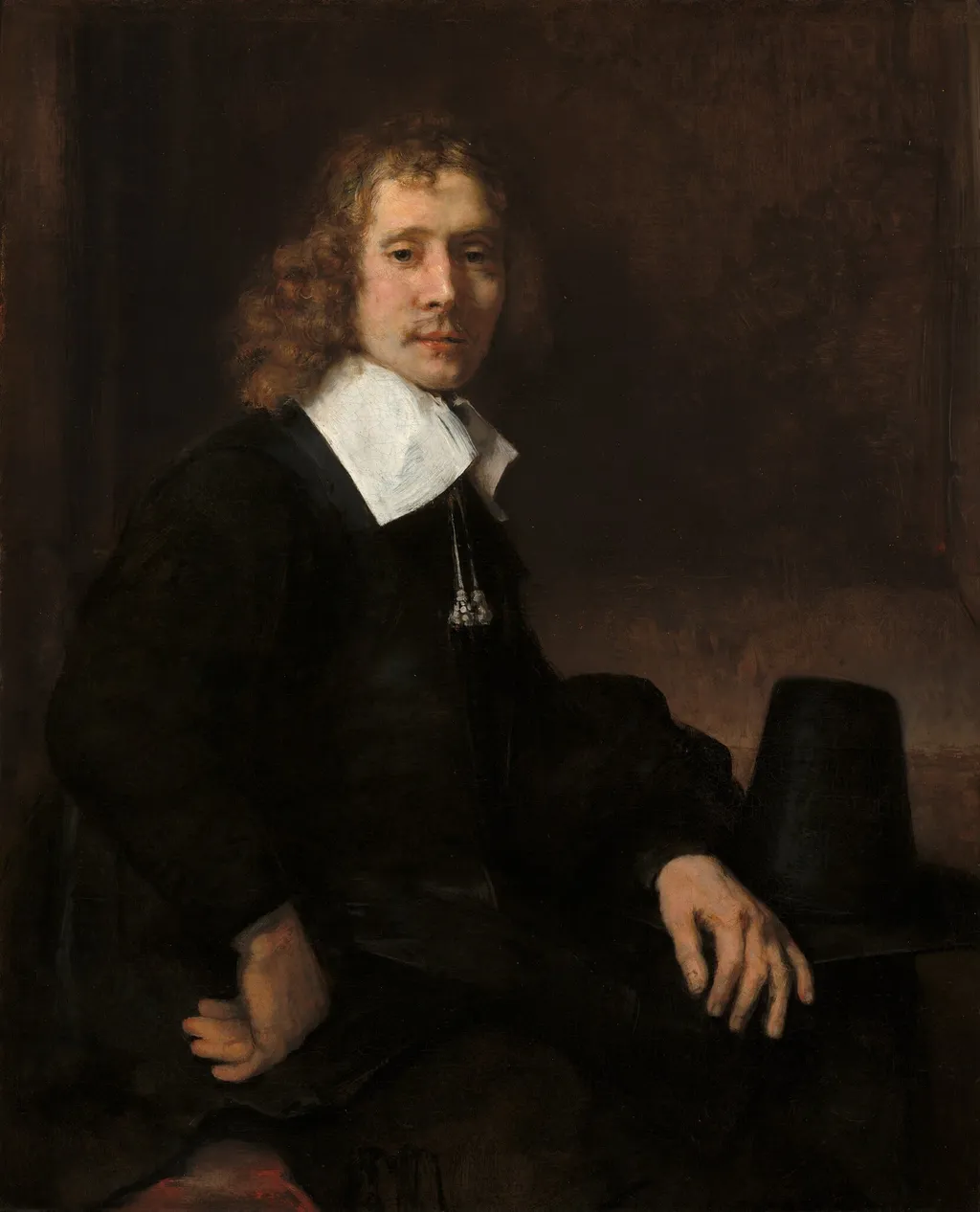 A Young Man Seated at a Table (possibly Govaert Flinck), by Rembrandt van Rijn, oil, 1660