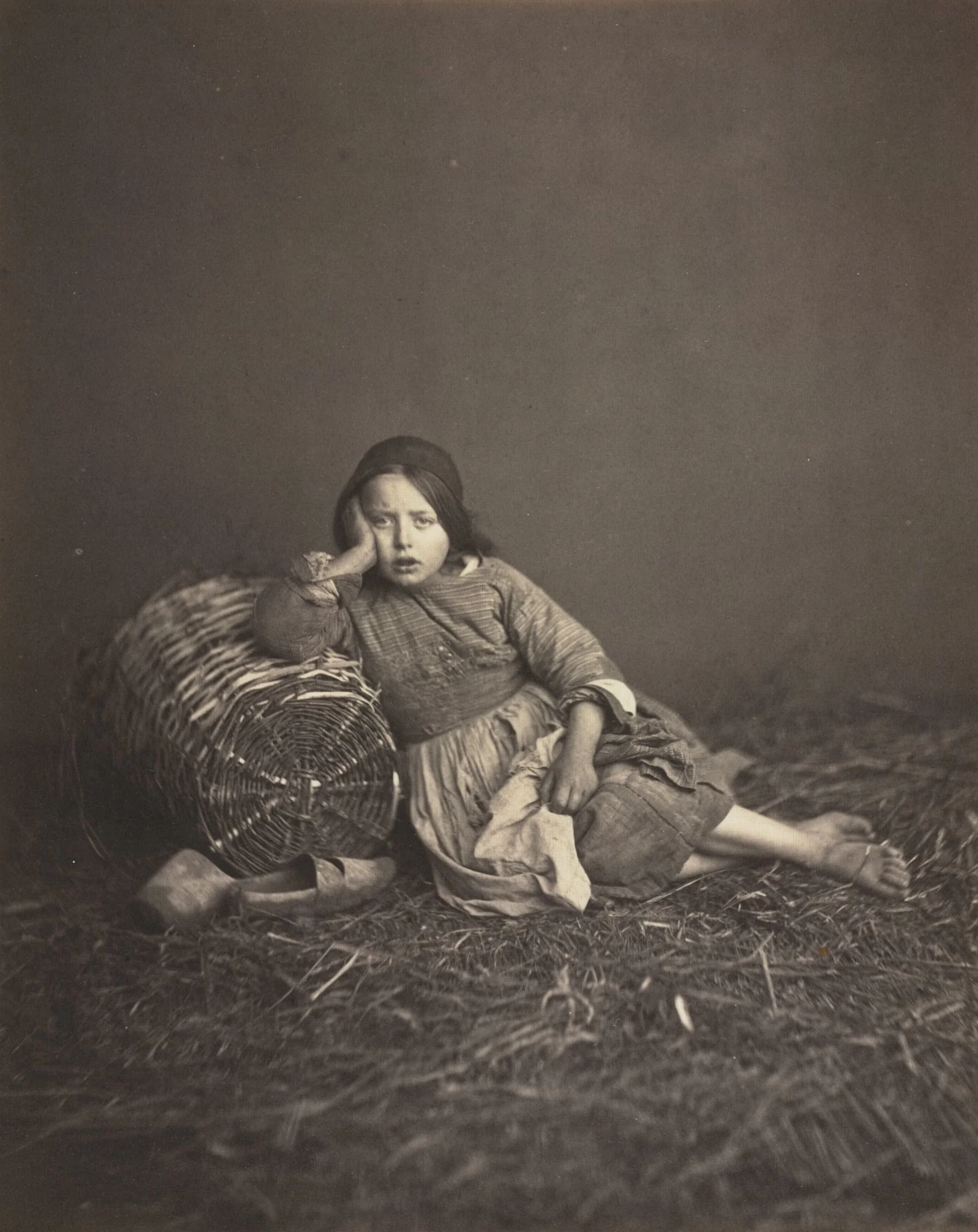 Young Girl Seated on Straw, Leaning on a Basket, detail