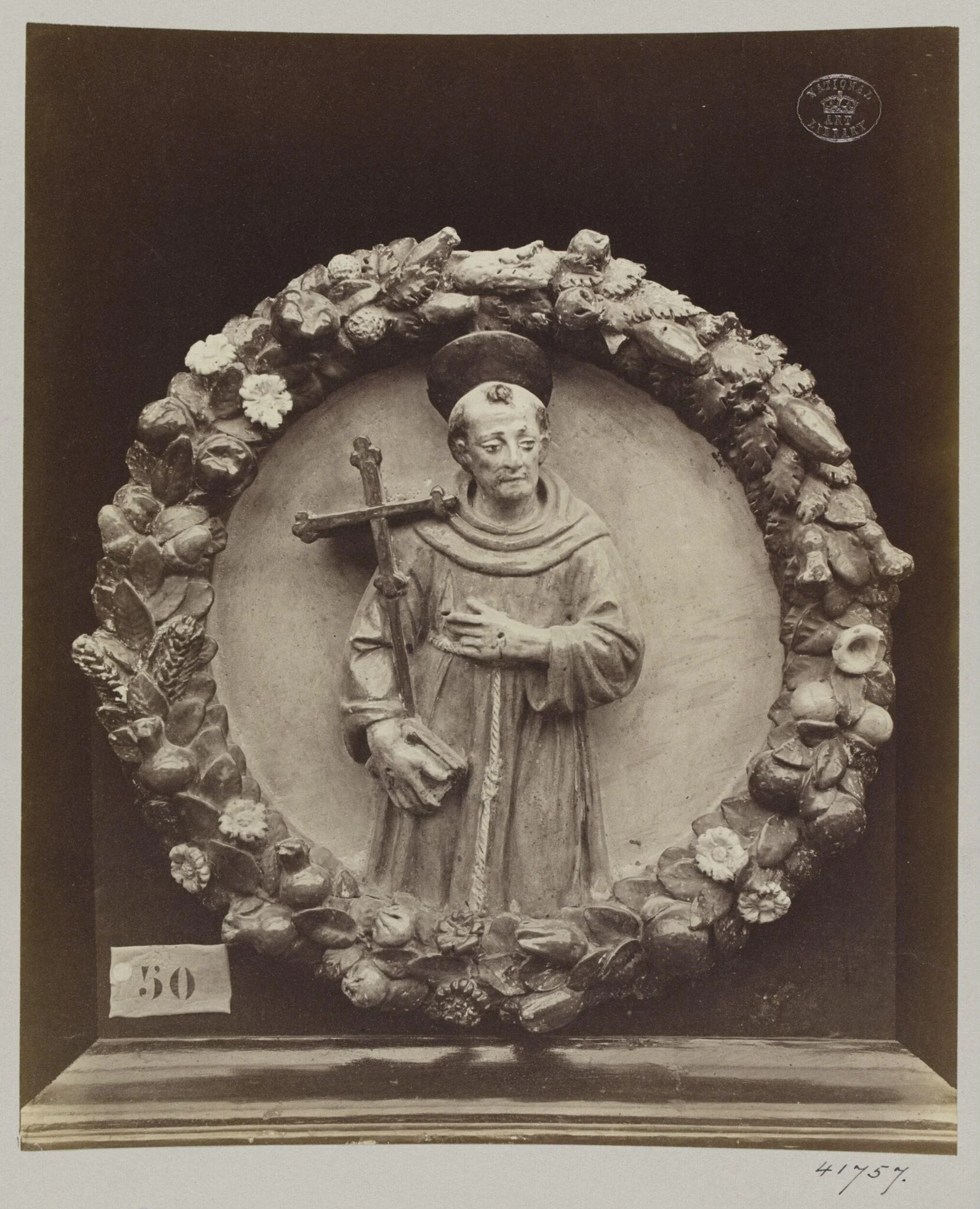 Enamelled bas-relief earthenware medallion of Saint Francis, detail
