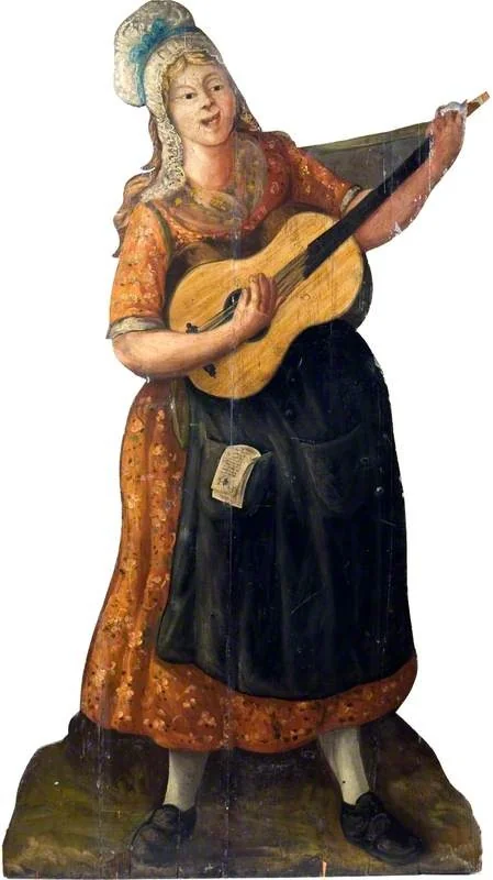 Female Street Player with a Guitar (dummy board), detail