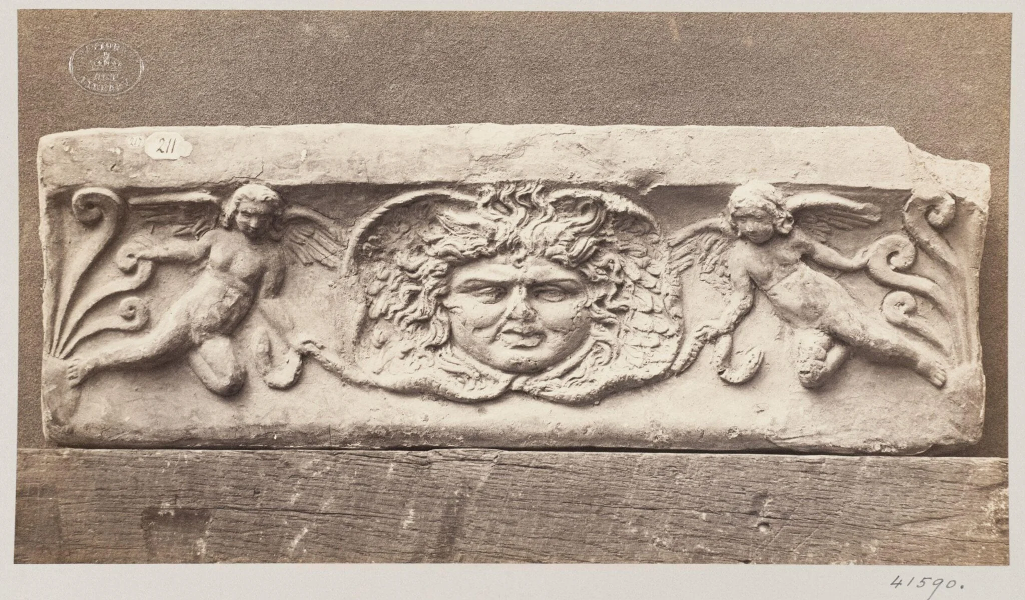 Bas-relief depicting a Gorgon Head in terra cotta, detail