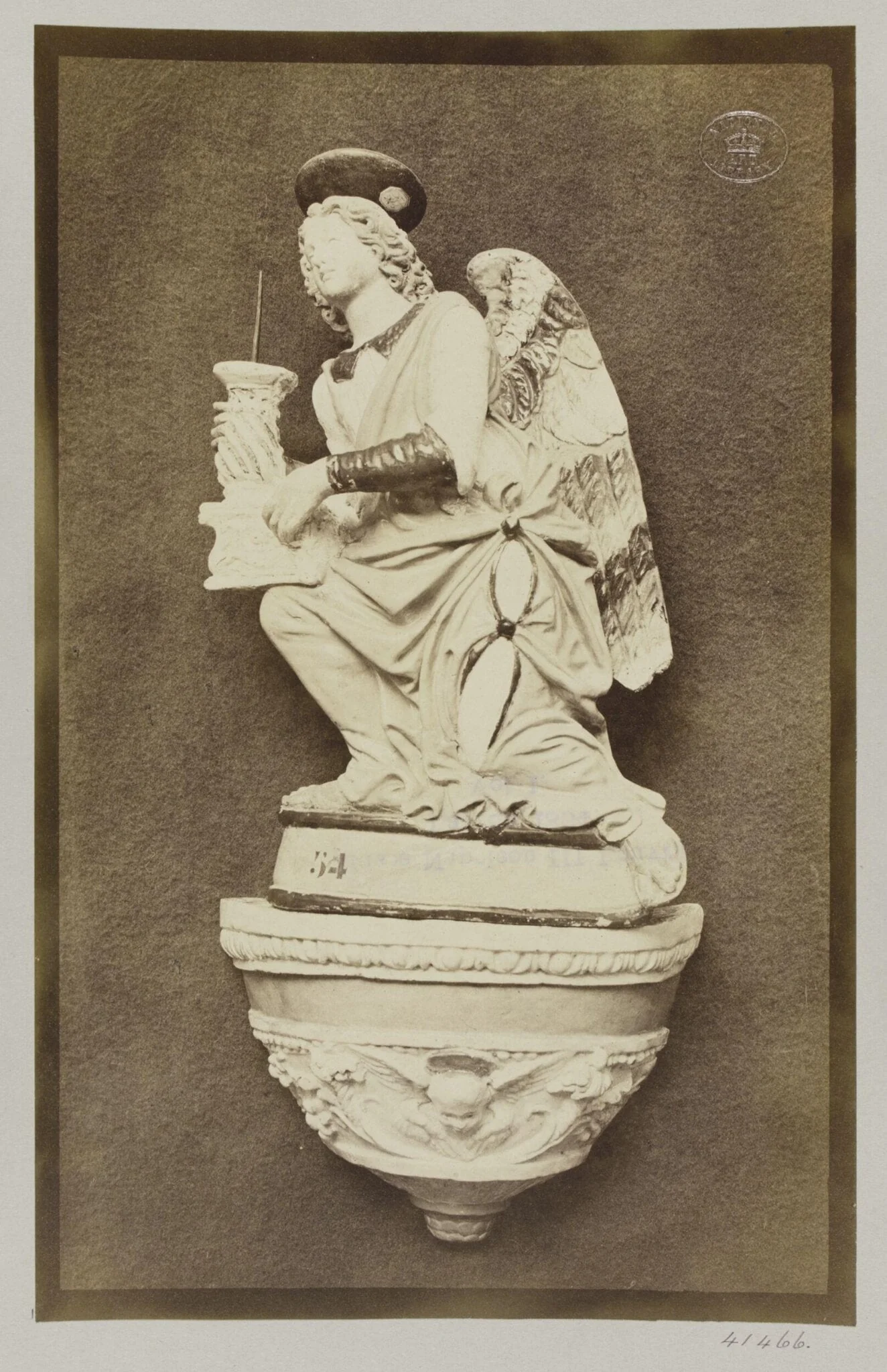 Figure of an Angel holding pricket candlestick by Luca della Robbia Ware, detail