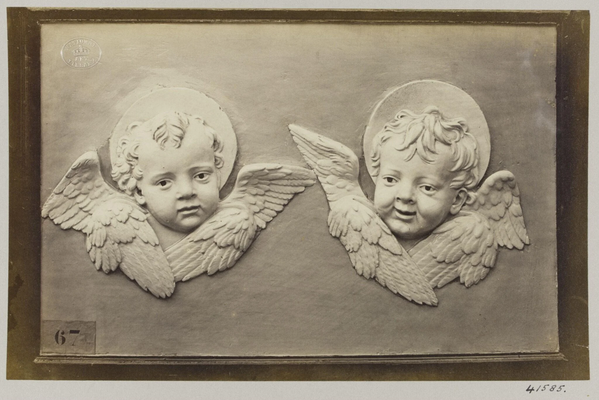 Two enamelled heads of seraphines, detail