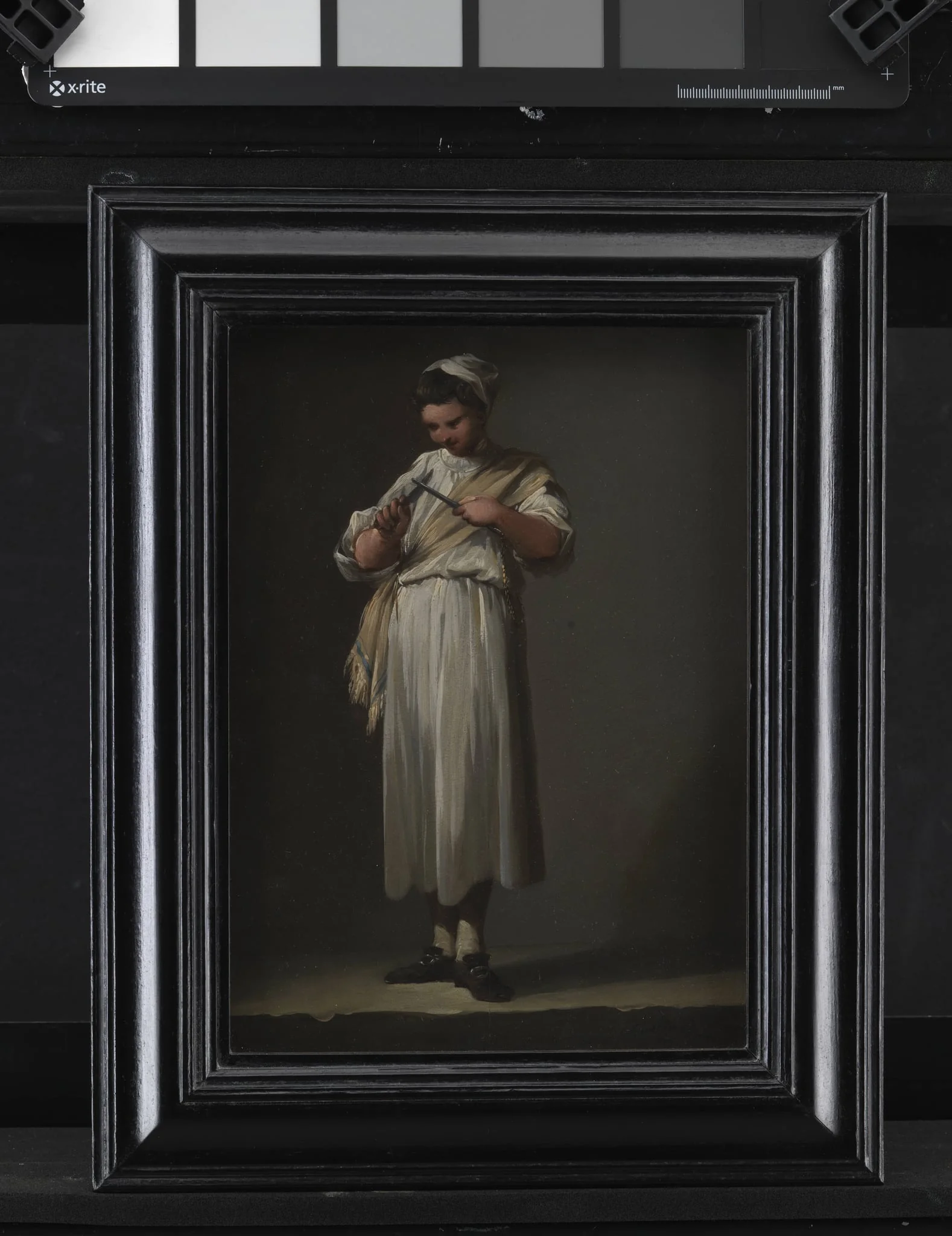 A Roman Cook´s Boy Sharpening a Knife, detail