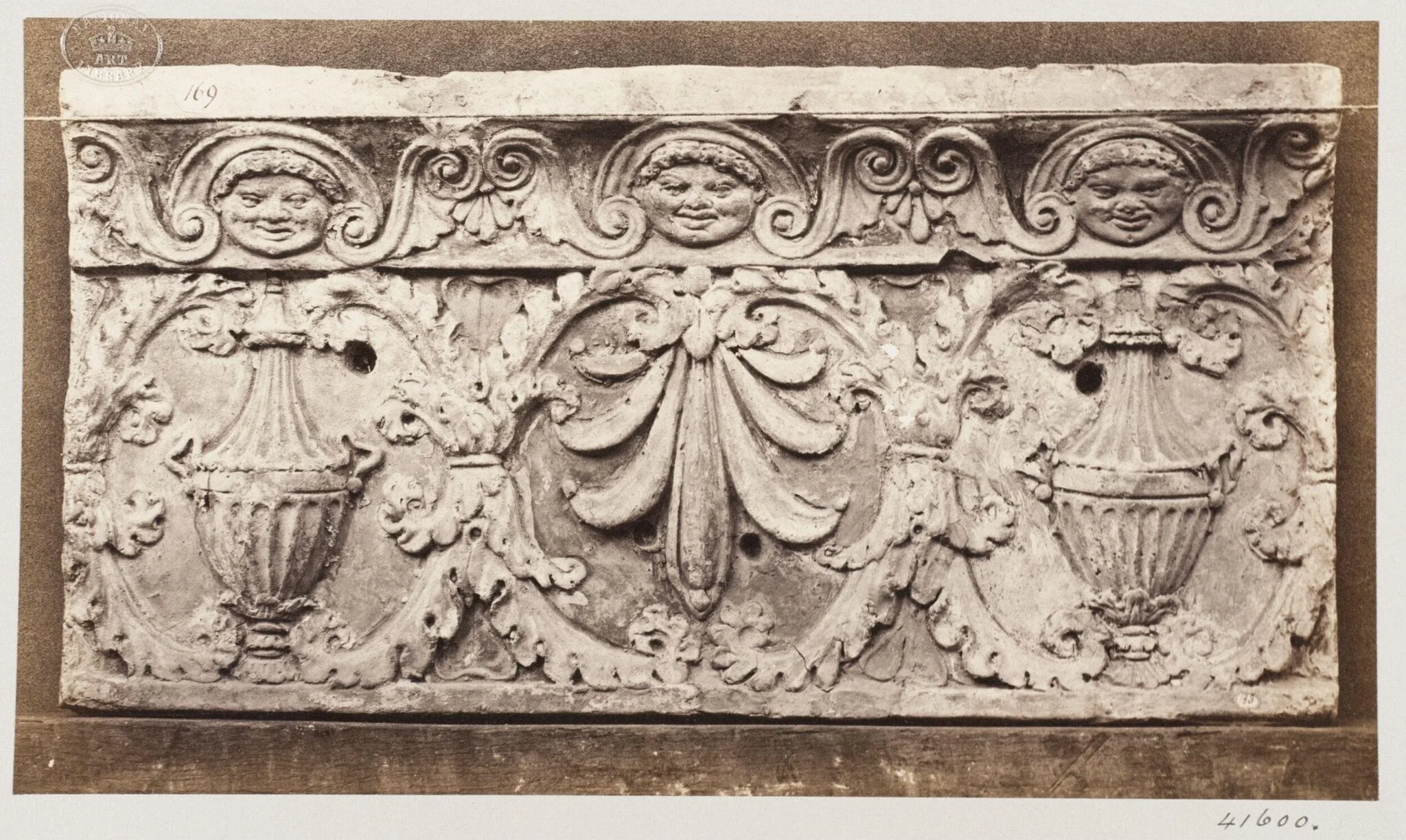 Bas-relief of portion of frieze with acanthus ornament enclosing vases and honesuckle in terra cotta, detail