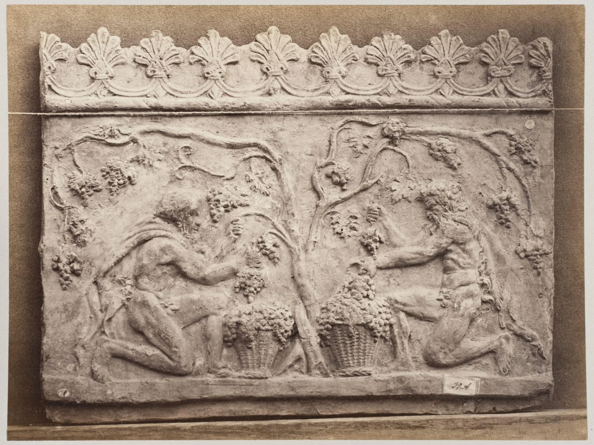 Bas-relief portion of a frieze of two satyrs in terra cotta, detail