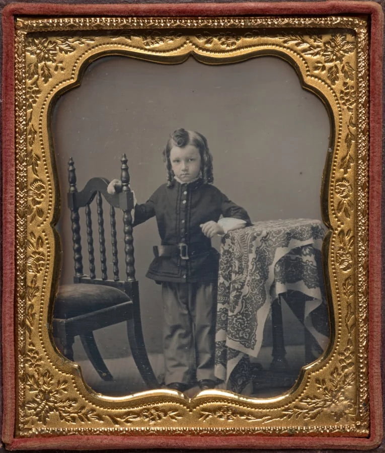 Standing boy with bottle curls, detail