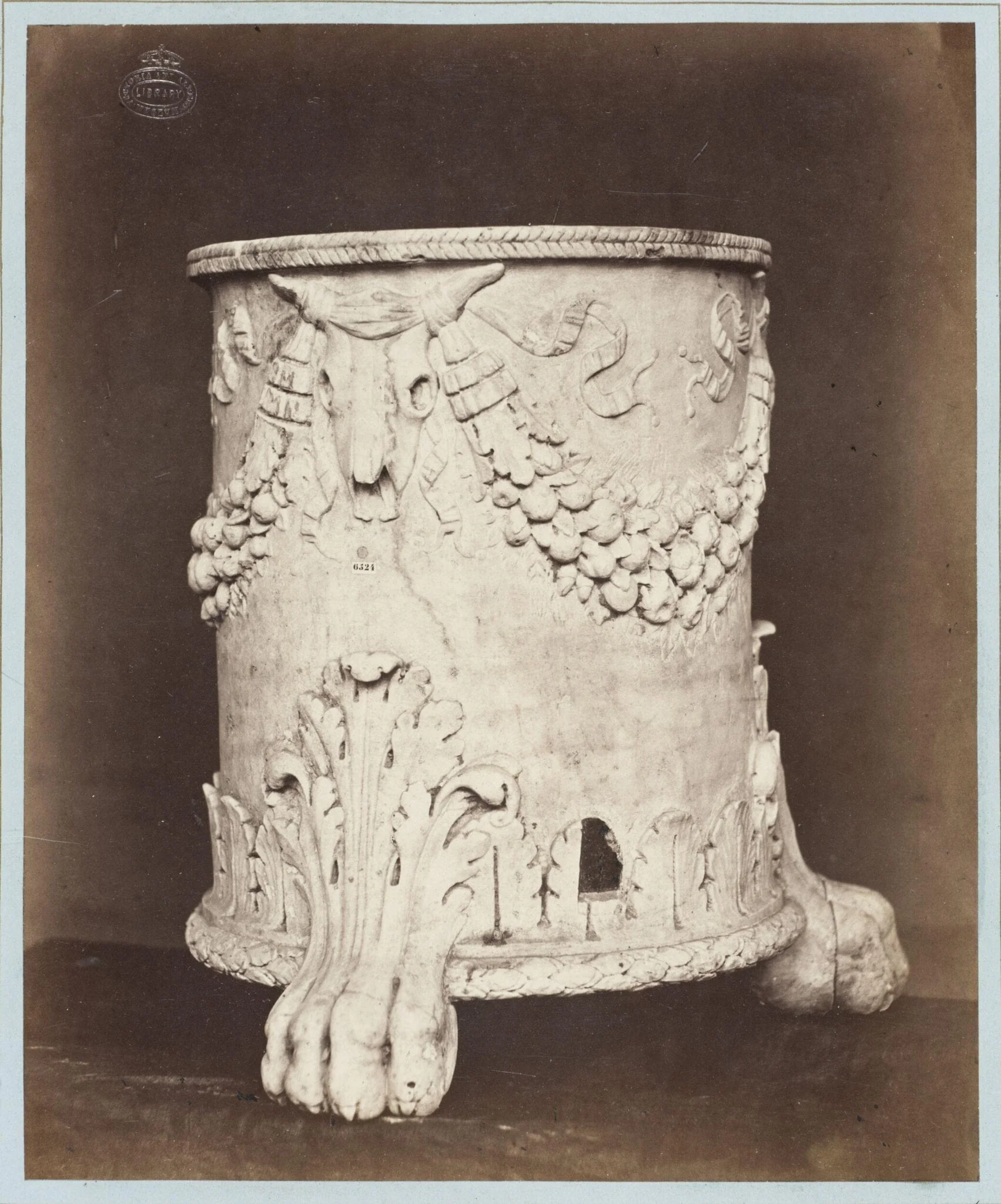 Marble socle ornamented in bas-relief, detail