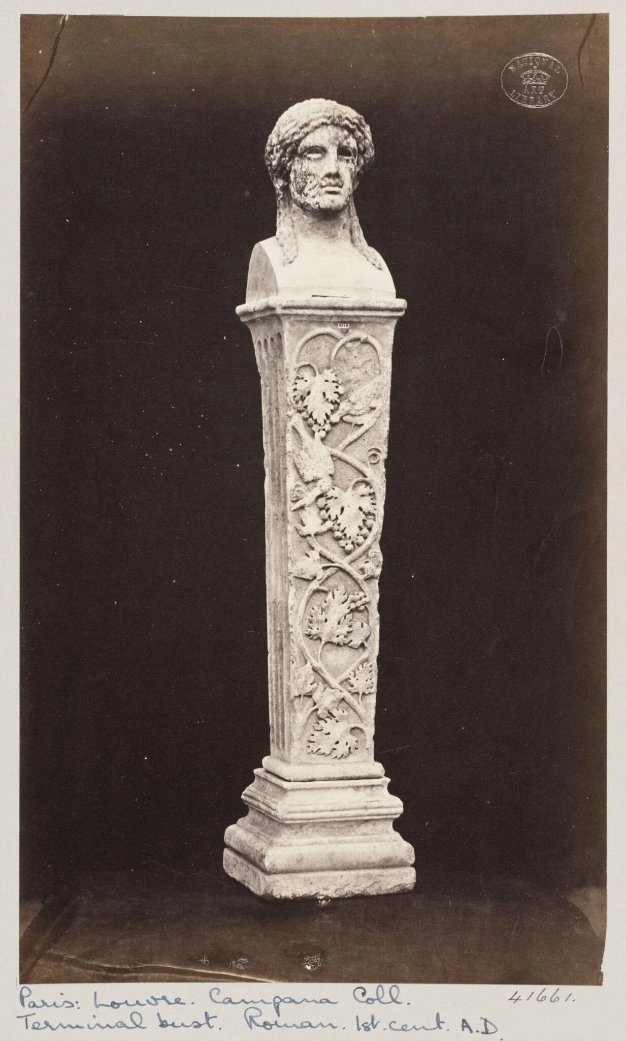 Marble herma with the head of Baccus ornamented with vine leaves and fruit, detail
