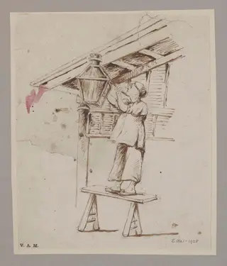 A man attending to a hanging lamp