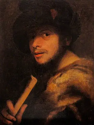 A Man Holding a Recorder