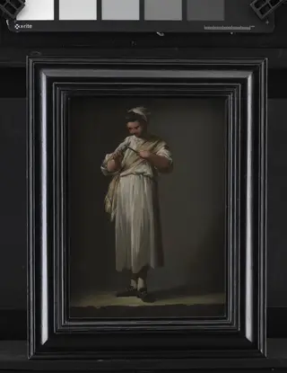 A Roman Cook´s Boy Sharpening a Knife