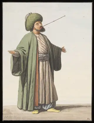 A Rufai dervish swallowing a red-hot skewer