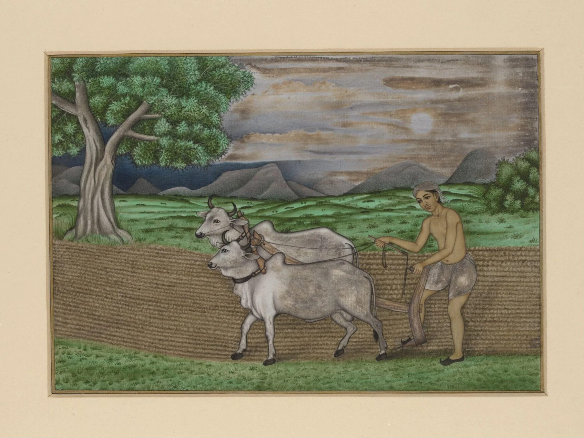 A villager ploughing with two bullocks; a hilly landscape in the background., detail