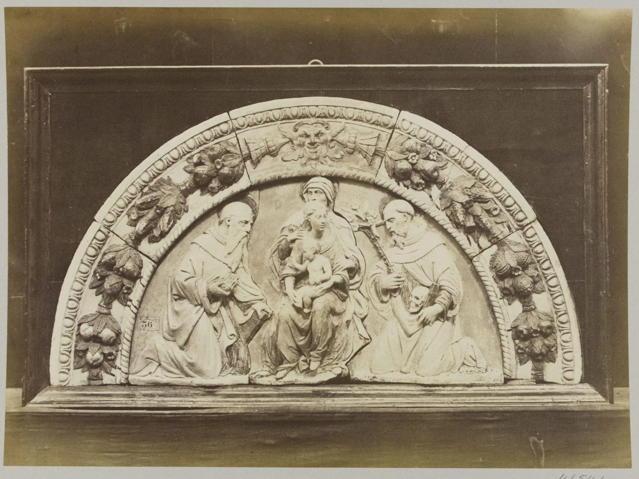 Top of an altar piece depicting the Holy Family in enamelled terra cotta, detail