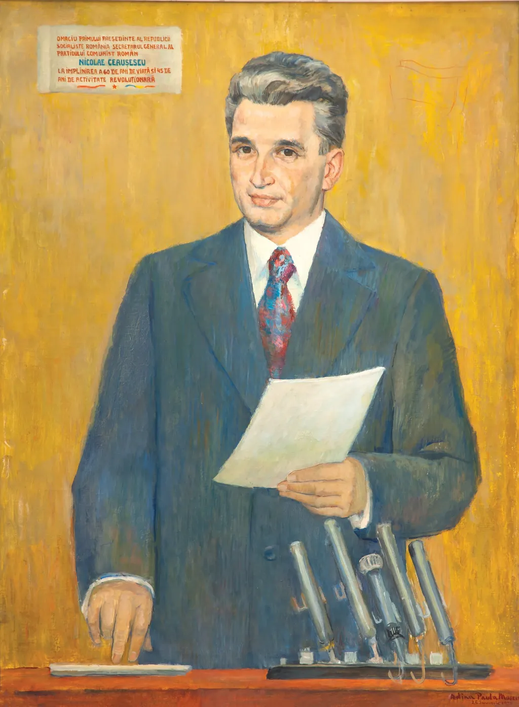 Tablou reprerzentându-l pe Nicolae Ceauțescu ținând un discurs. Semnat în partea dreaptă jos ”Adina Paula Moscu”. Oferit cadou lui Nicolae Ceaușescu pe 26 ianuarie 1978 cu ocazia aniversării vârstei de 60 de ani. În stânga sus dedicație ”Omagiu primului președinte al Republicii Socialiste România, secretar general al Partidului Comunist Român, Nicolae Ceaușescu, la împlinirea a 60 de ani de viață și 45 de ani de activitate revoluționară.”, by Adina Paula Moscu