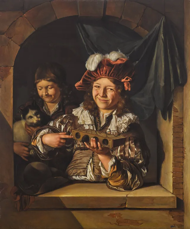Two boys with a mouse trap and a cat at a window