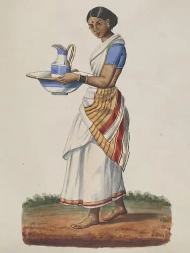 An ayah in a blue choli carrying a china ewer and basin