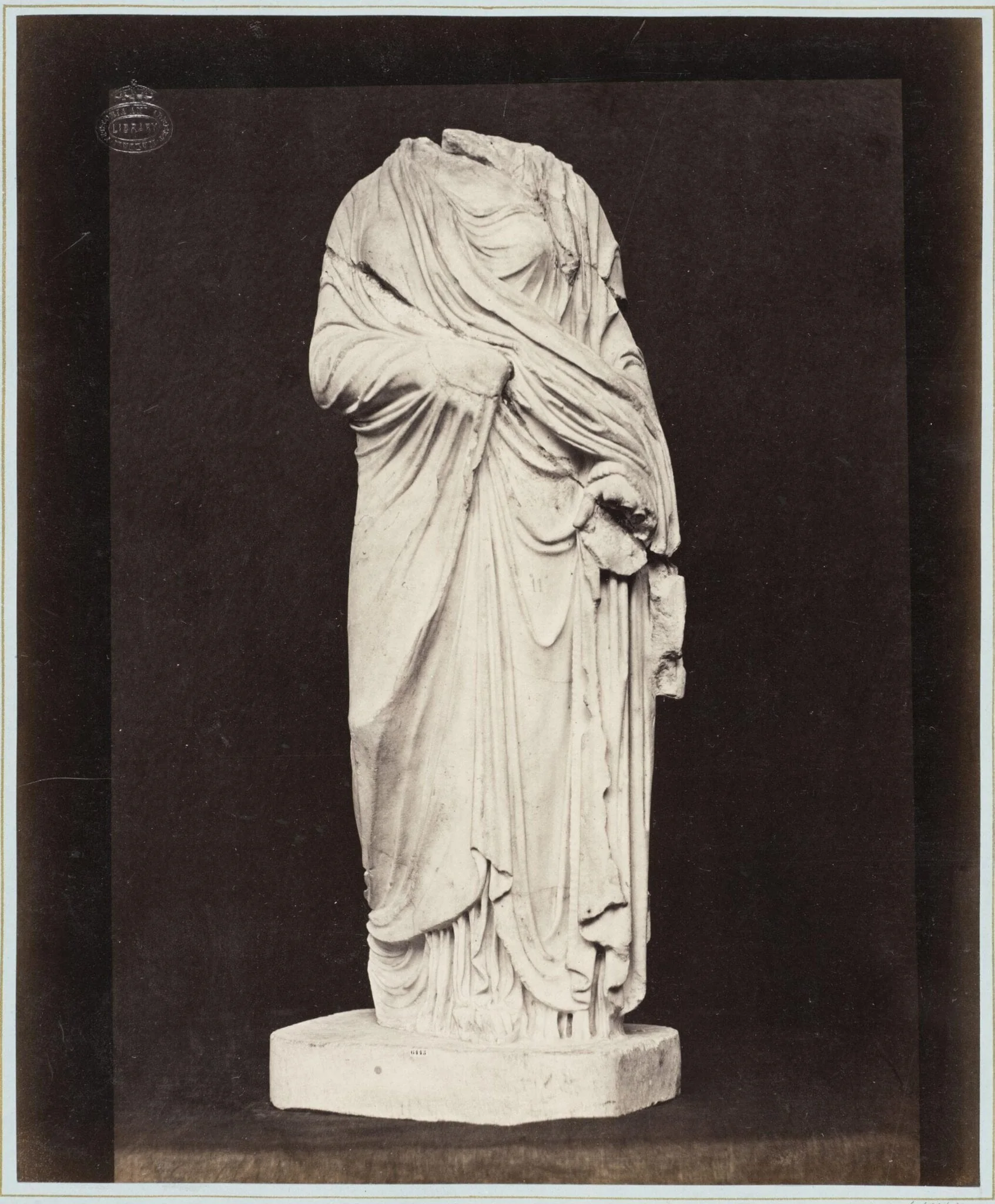 Marble statue of a headless draped figure, detail