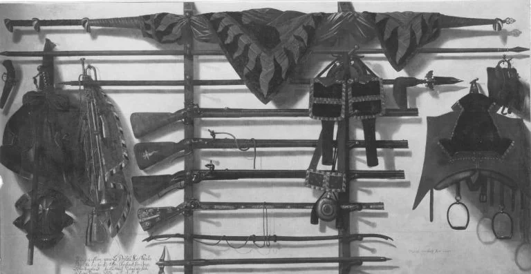 Trompe l'oeil of a wooden rifle rack, a regimental banner, two single-barrelled rifles, a Silesian tschinke, horse saddle with tack and other weaponry hanging on a white wall, detail