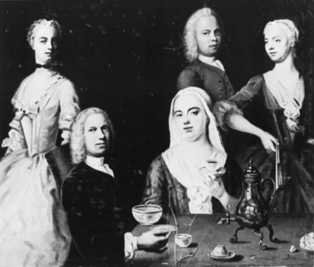 The artist sitting at the table with his family. Self-portrait, by Balthasar Denner