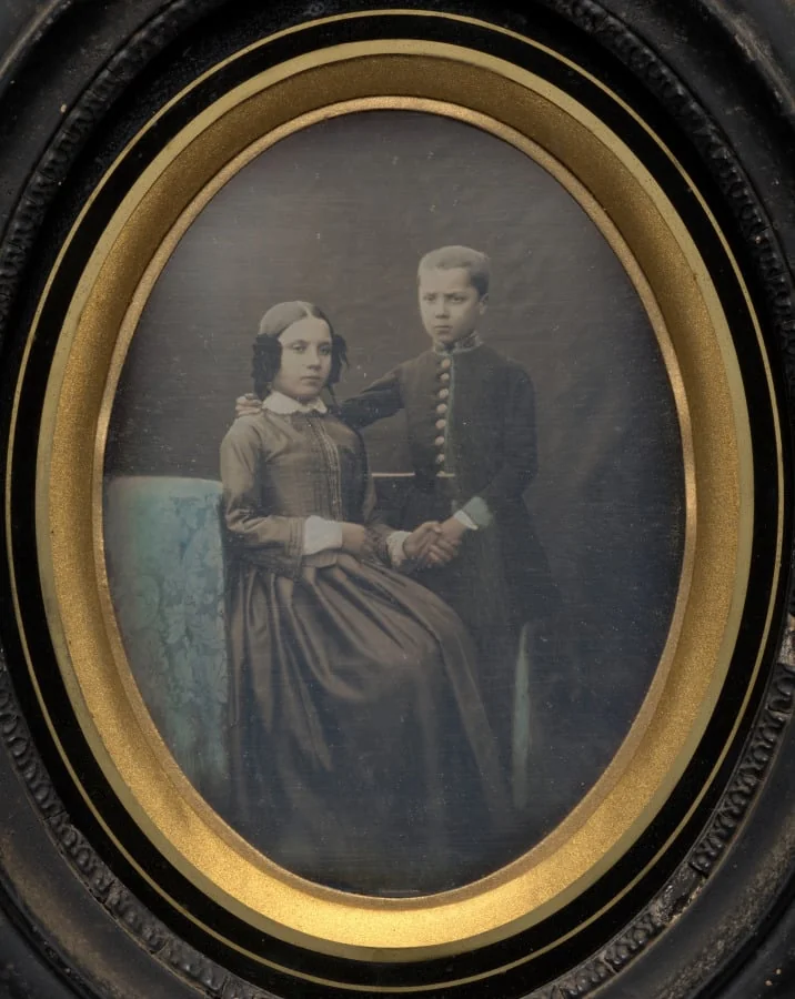 Brother and sister clasping hands, detail