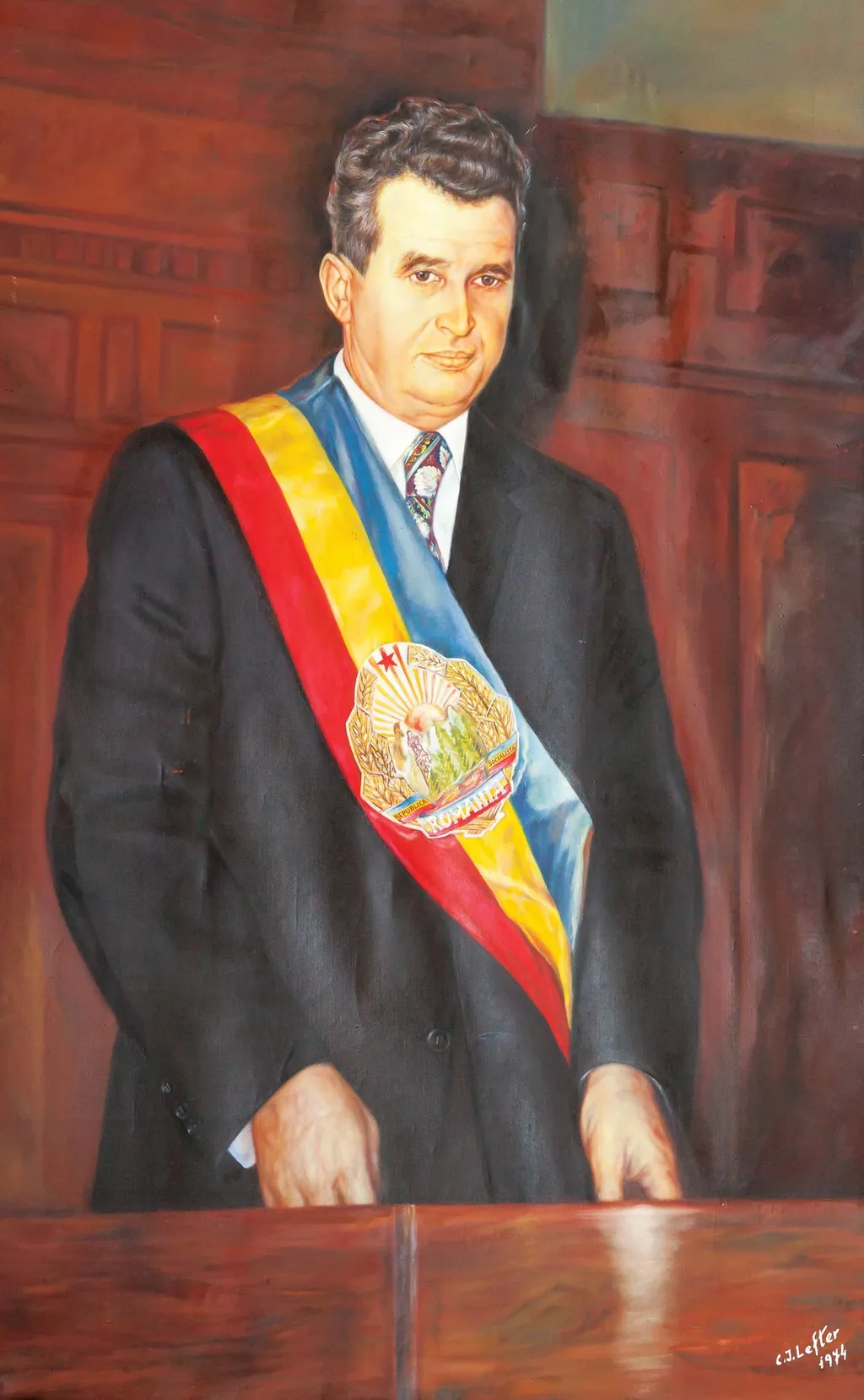 Tablou, ulei pe pânză, ”Portret Nicolae Ceaușescu”, semnat C.I. Lefter și datat 1974 în partea dreaptă jos. Reprezentat într-un cadru oficial în spatele unui pupitru, Nicolae Ceaușescu purtând eșarfa cu stema RSR. Oferit lu Nicolae Ceaușescu de Comitetul de Partid Sănătatea, cu ocazia zilei de naștere, ianuarie 1978., by C.I. Lefter