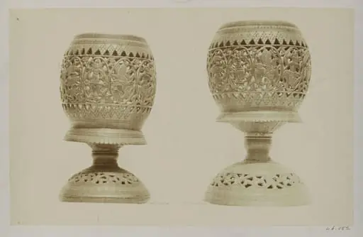 Modern Javanese sculpture, two carved cocoa-nut cups, by Charles Thurston Thompson