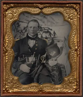 Civil War soldier with painted bivouac background