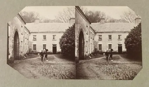 West Wing of Dundrum House with unidentified man with camera on tripod, by Clementina Hawarden