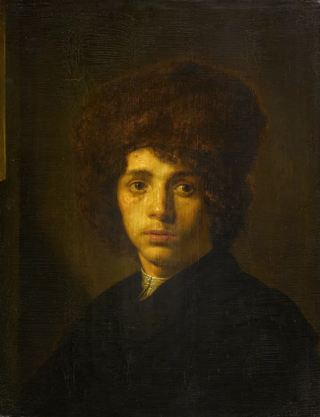 Young man with a fur hat