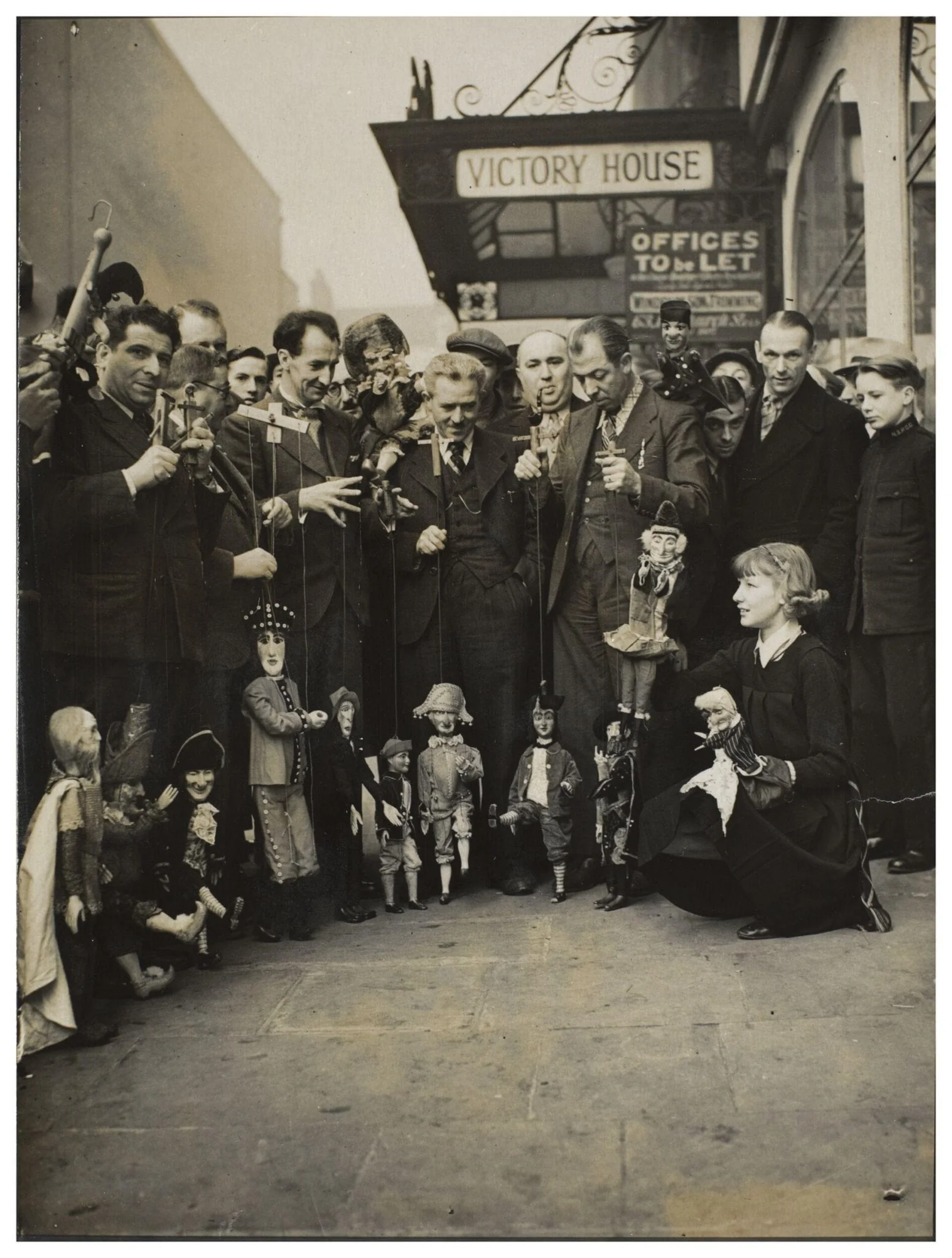 Photograph of puppeteers at the opening of the 13th Exhibition of the British Puppet and Model Theatre Guild, 1938, detail