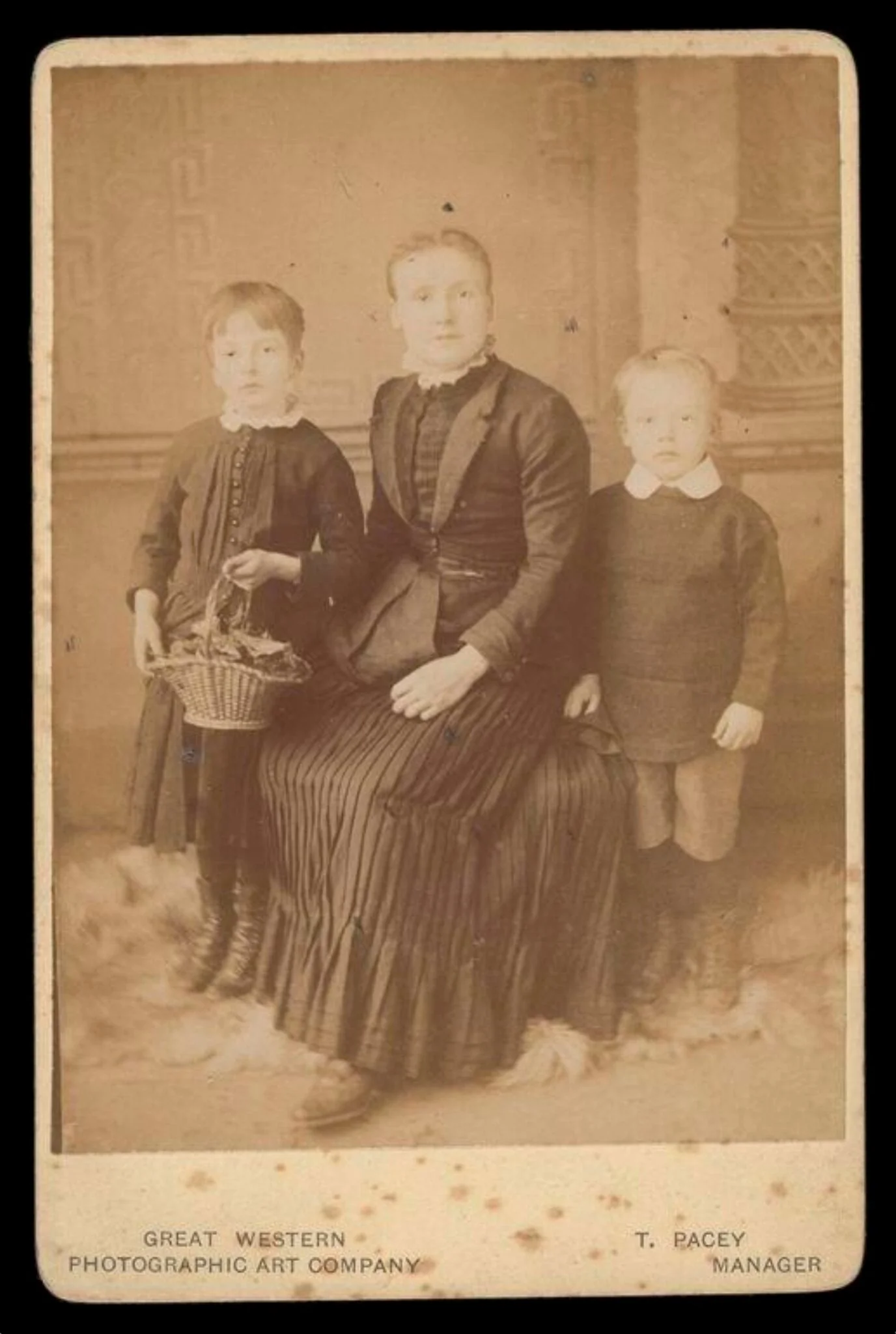 Portrait of a woman and two children, detail