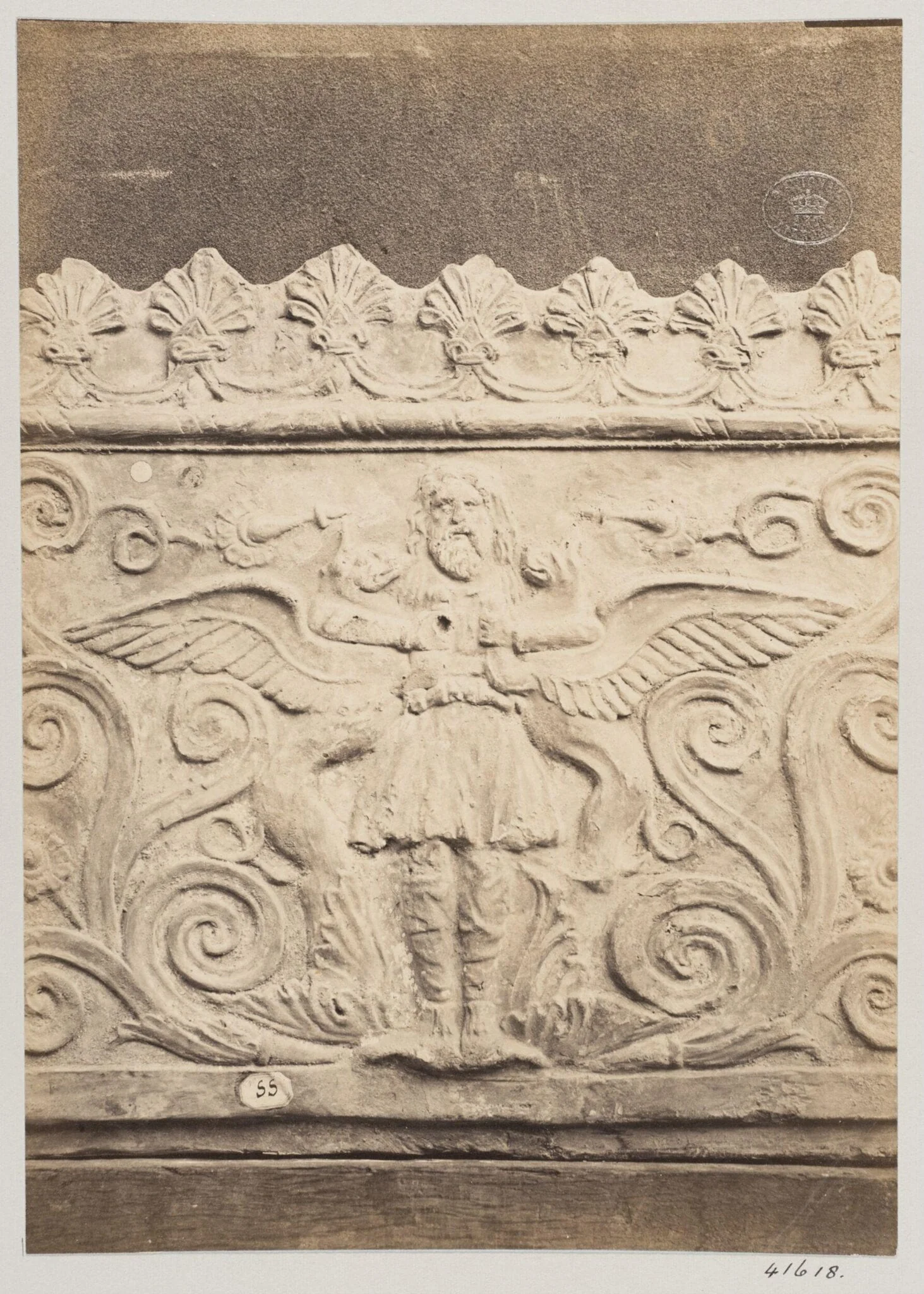 Bas-relief portion of a frieze of a flying genie in terra cotta, detail