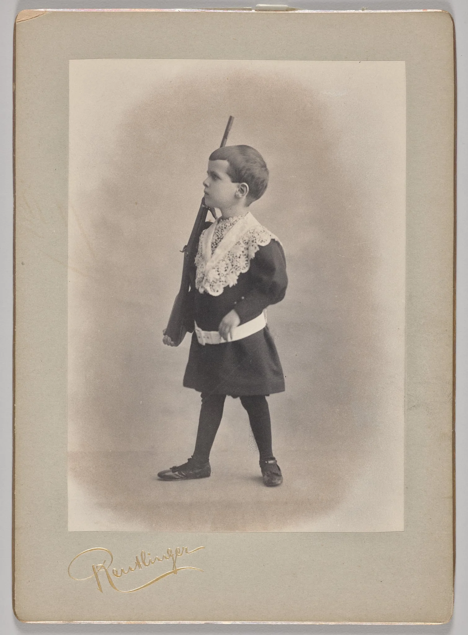 Untitled (young boy with lace collar and toy rifle), detail
