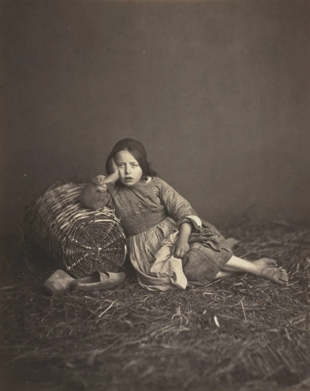 Young Girl Seated on Straw, Leaning on a Basket, by Edmond Bacot, 1862