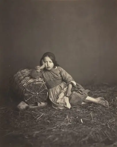 Young Girl Seated on Straw, Leaning on a Basket, by Edmond Bacot