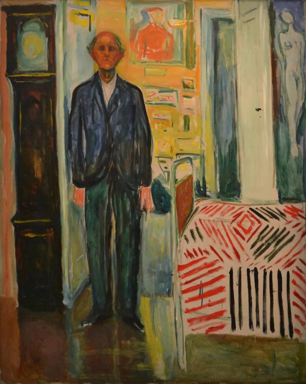 Self-Portrait. Between the Clock and the Bed, by Edvard Munch, oil, 1940