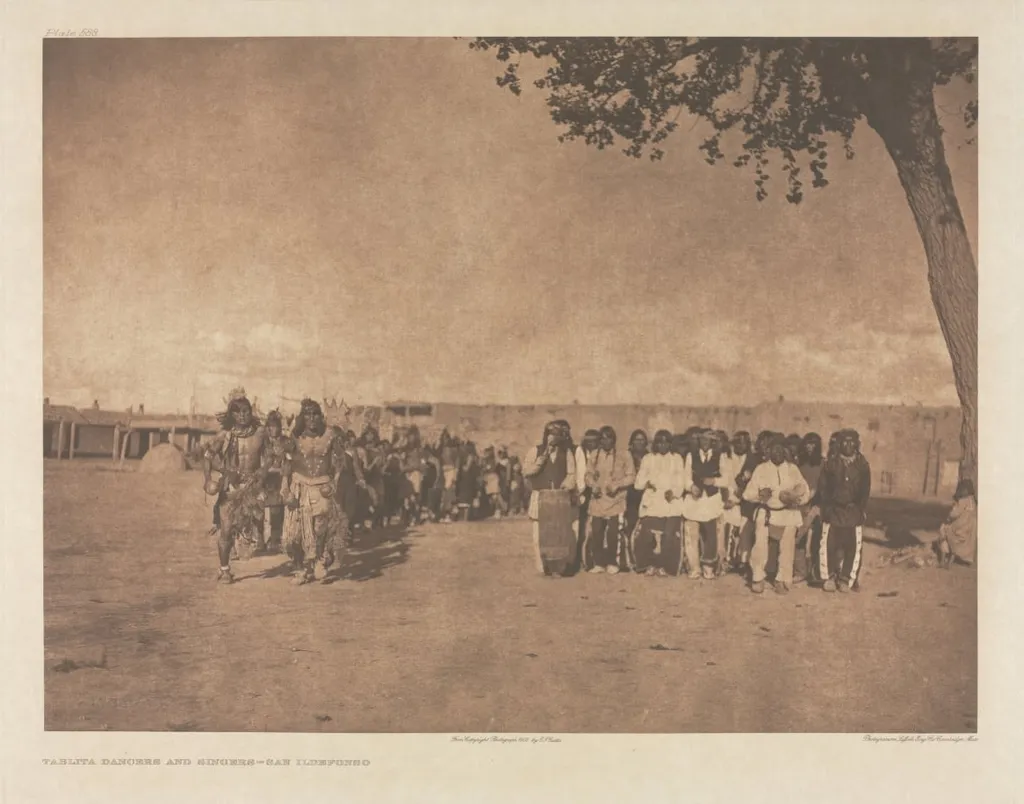 Portfolio XVII, Plate 588: Tablita Dancers and Singers - San Ildefonso, by Edward S. Curtis, 1905