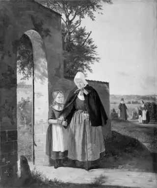En gammel kone på vej til kirke
