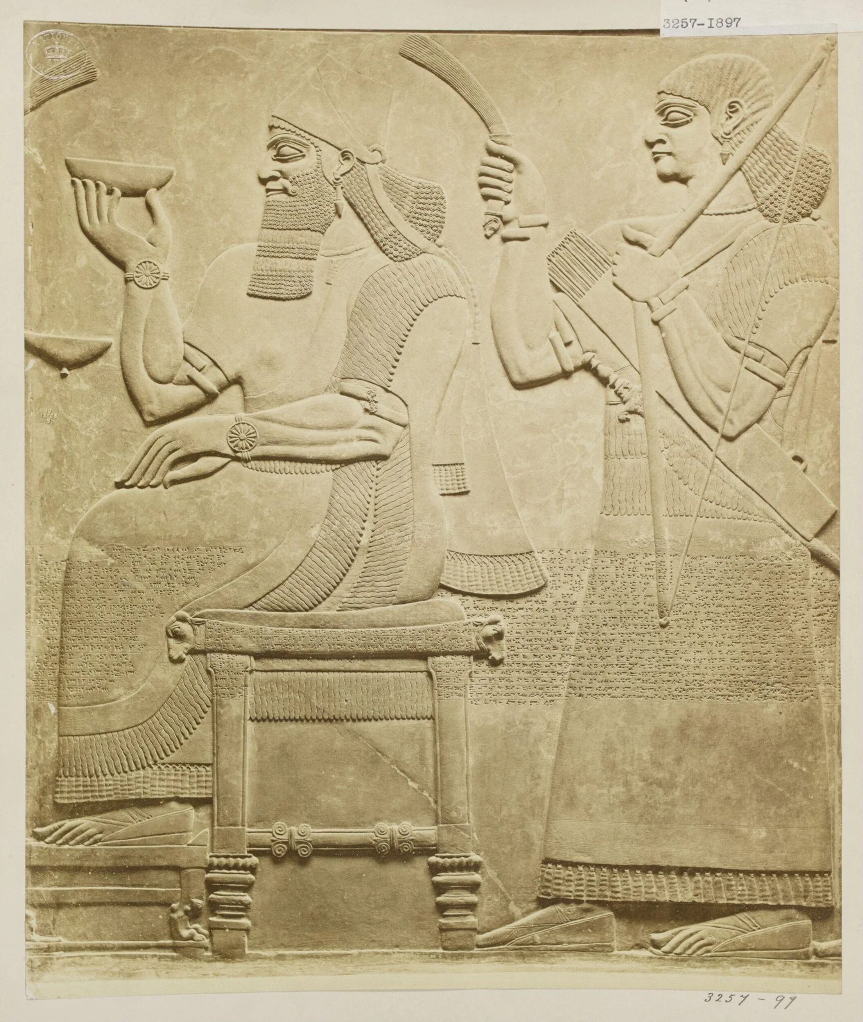 Sculpture, relief of figure seated with attendant. London: British Museum, detail